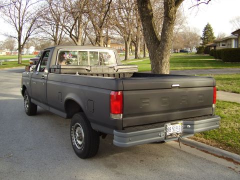 1996 Ford F-150 - This Ford F-Series truck has a matte black finish and a standard cab.