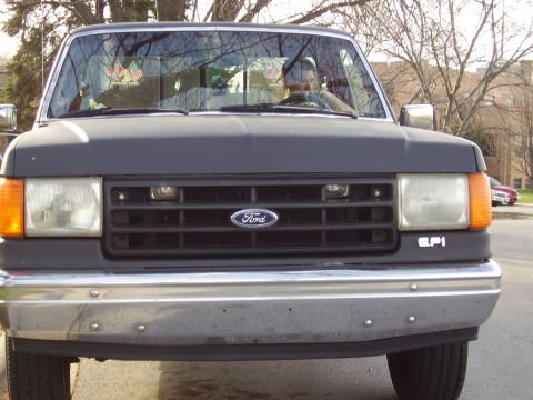 1996 Ford F-150 - Front view of a Ford F-150 pickup truck, its grille, headlights, and bumper. The text 'EFI' is visible on the fender.