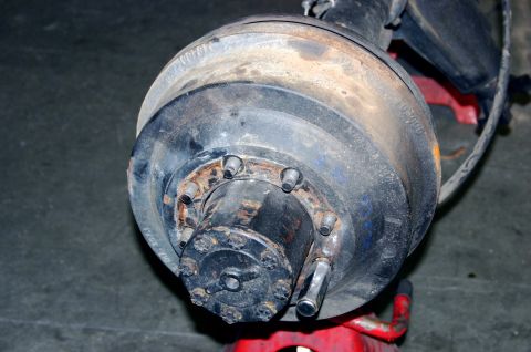 1995 Ford Bronco - This image shows a close-up view of a vehicle's rear axle hub and brake drum assembly.