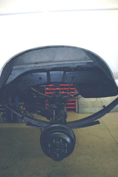 1995 Ford Bronco - Close-up view of the rear axle assembly, showing leaf springs and brake components.