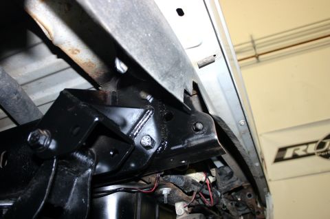 1995 Ford Bronco - Close-up view of aftermarket suspension components, likely for an off-road vehicle modification.