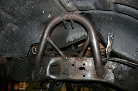 1995 Ford Bronco - Custom suspension modification with U-shaped tubing welded to the frame, likely for off-road use.