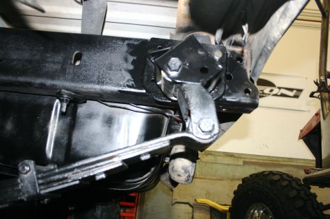 1995 Ford Bronco - Close-up view of a vehicle's suspension system, showing leaf springs, a fuel tank, and a suspension component.