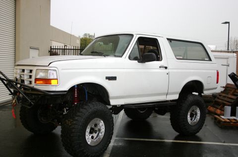 1995 Ford Bronco - This modified 1992 Ford Bronco features oversized tires and an aftermarket front bumper.