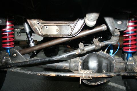 1995 Ford Bronco - Modified front suspension components, including coilovers and steering assembly.