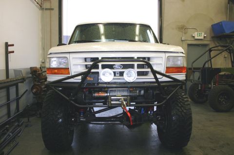 1995 Ford Bronco - This 1995 Ford Bronco features a custom front bumper with a winch and auxiliary lights.