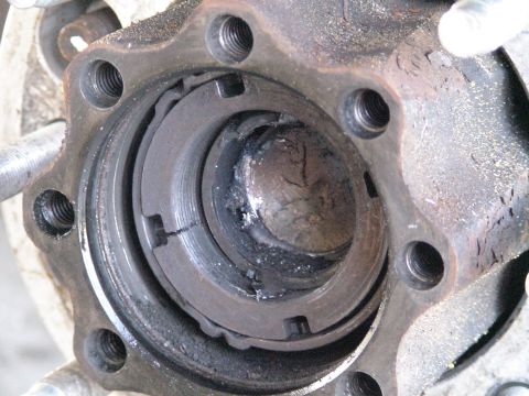 1993 Ford C-350 (Centurion Conversions) - Damaged wheel bearing assembly showing signs of wear and metal fragments.