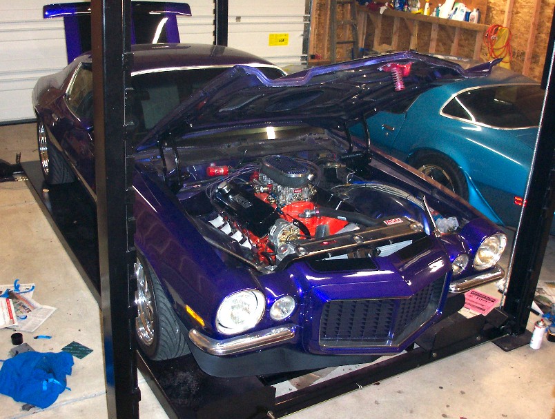 Purple 1970 Chevrolet Camaro front view, hood open, on lift