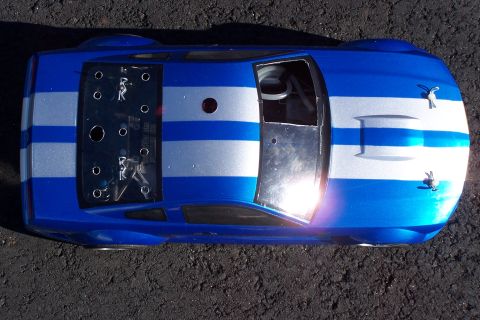 1994 Ford Bronco - This blue and silver striped vehicle appears to be a custom race car, viewed from directly overhead.