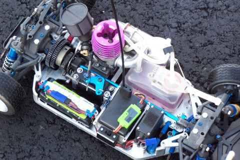 1994 Ford Bronco - Close-up view of a remote control car's internal components, including its engine and drivetrain.