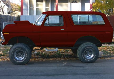 1978 Ford Bronco - This modified SUV features a prominent hood scoop and is elevated on large off-road tires.
