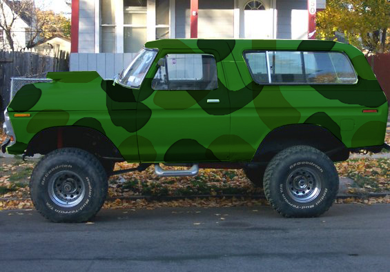1978 Ford Bronco with camouflage paint and lifted suspension parked on a street