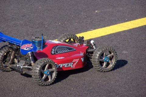 1994 Ford Bronco - This remote control buggy has "HYPER 7" text on its side and an "OFNA Racing" sticker.