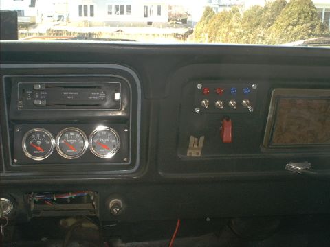 1978 Ford Bronco - Dashboard of a 1978 Ford Bronco with oil, water, and transmission gauges installed.