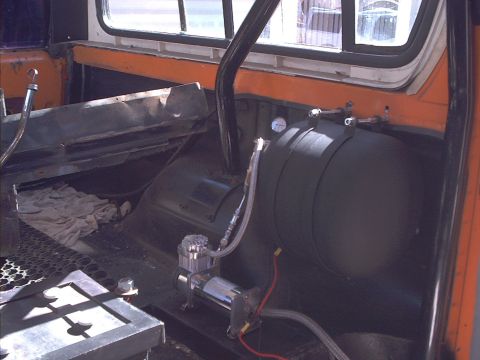 1978 Ford Bronco - Custom interior modifications include an air compressor and tank system, with a visible pressure gauge.