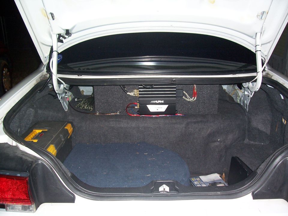 Trunk interior with Alpine amplifier and toolbox. 1997 Ford Crown Victoria