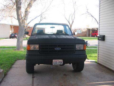 1991 Ford Bronco - Front view of a 1991 Ford Bronco parked in a driveway.
