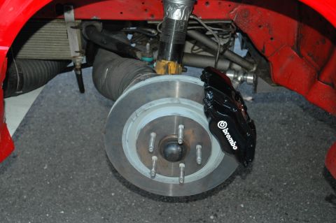 1993 Ford Mustang - Brembo brake caliper and rotor assembly shown on a vehicle.