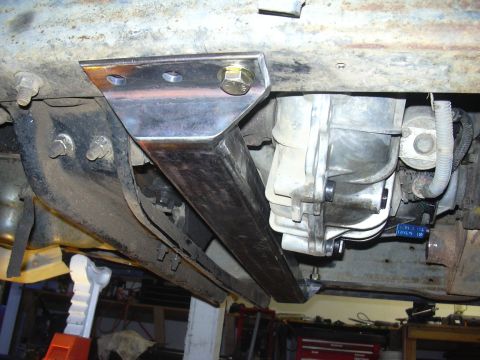 1991 Ford Bronco - Underbody view of a custom-fabricated transmission crossmember bracket and transfer case assembly.