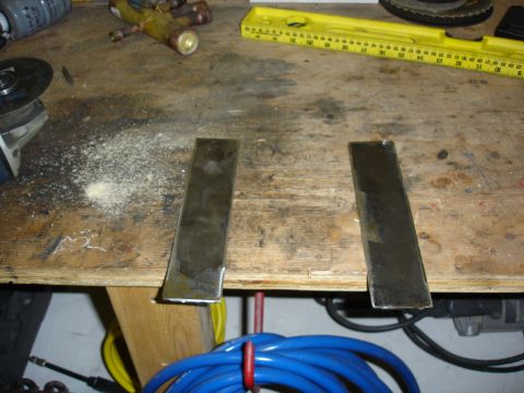 1996 Ford Bronco - Metal plates are laid out on a workbench, ready for work.