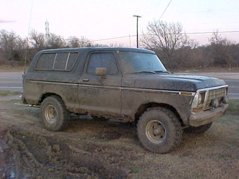 1978 Ford Bronco - This 1978 Ford Bronco is covered in mud, suggesting it has been off-roading.