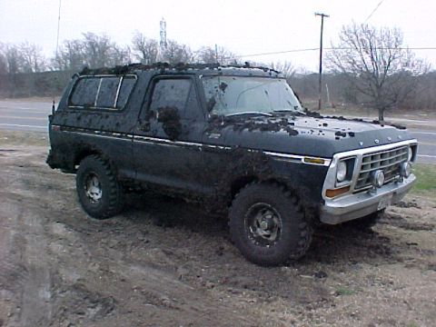 1978 Ford Bronco - This 1978 Ford Bronco is heavily covered in mud, suggesting it has been driven off-road.