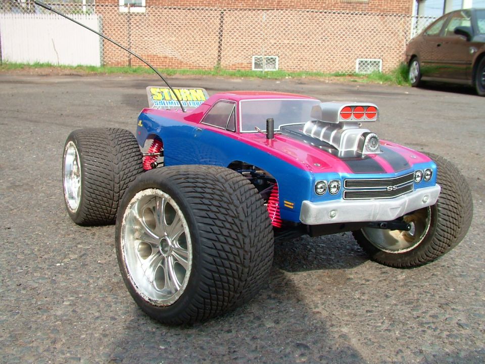 RC monster truck with blue and pink Chevelle SS body and exposed blower on big tires