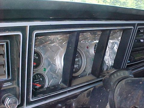 1978 Ford Bronco - Custom diamond plate panel covers the dashboard gauges, showing a fuel gauge and speedometer.