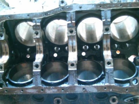 1986 Ford Bronco - This is a close-up view of an engine block, showing the internal cylinder bores.