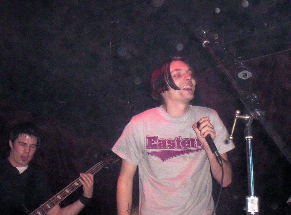Singer with "Easter" shirt and bassist on stage