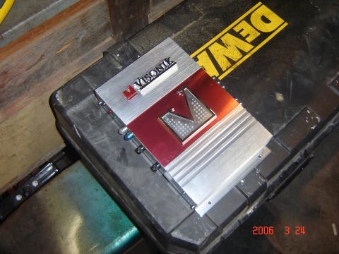 1993 Ford Bronco - A Visonik car amplifier is shown resting on a black case with a yellow DeWalt logo visible.