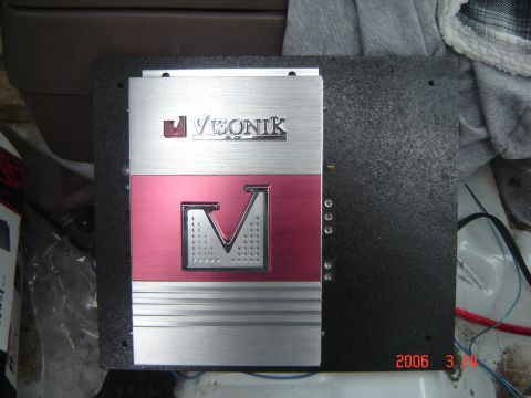1993 Ford Bronco - A Visonik car amplifier is shown mounted on a black board, with visible wiring.