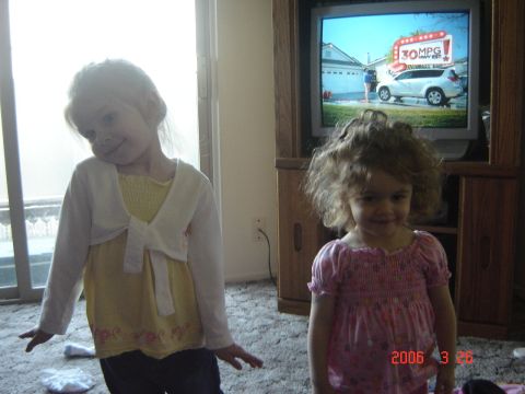 1993 Ford Bronco - Two young girls are in a room, with a television in the background showing a car commercial.