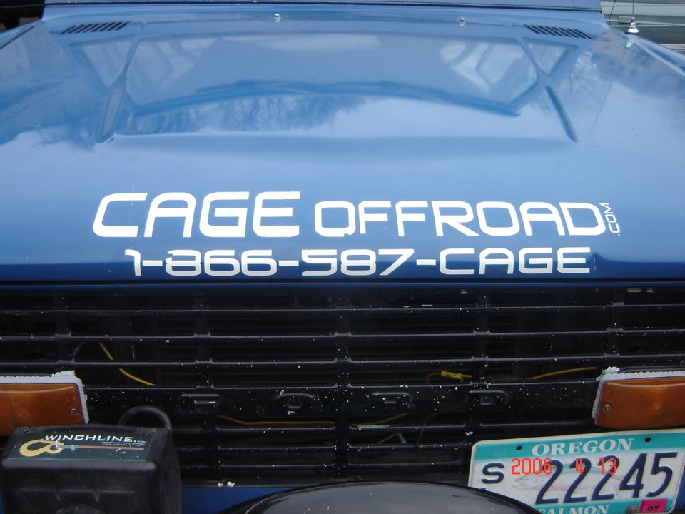 Blue SUV hood with CAGE OFFROAD and 1-866-587-CAGE text