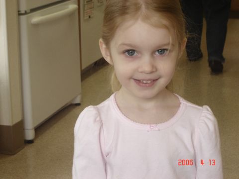 1993 Ford Bronco - A young girl poses for a photo indoors, with a watermark indicating the date and website.