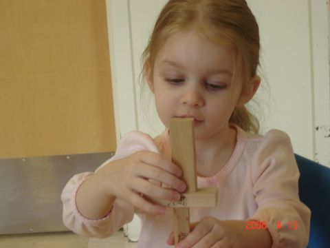 1993 Ford Bronco - A young girl concentrates while playing with a wooden toy.