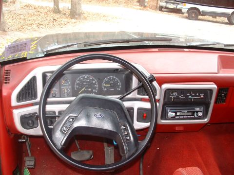 1988 Ford Bronco - Interior view of a 1988 Ford Bronco, highlighting the dashboard and driver's controls.