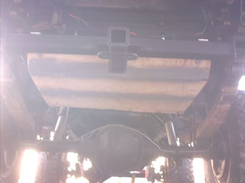 1978 Ford Bronco - The underside of a vehicle is visible, including the rear differential and suspension parts.