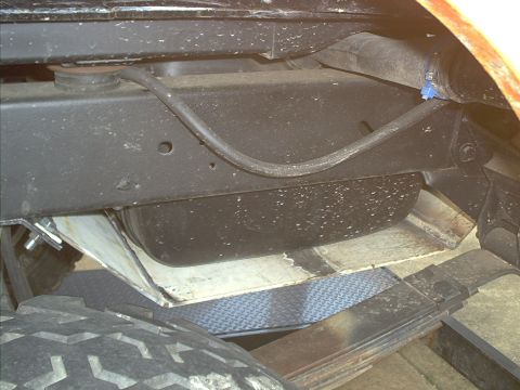 1978 Ford Bronco - Undercarriage view shows fuel tank, suspension, and frame parts.