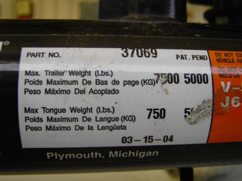 1995 Jeep YJ - Label on a trailer hitch shows part number 37069, maximum trailer weight of 7500 lbs, and maximum tongue weight of 750 lbs.