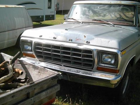 1986 Ford Bronco - Front view of a silver Ford truck, likely from the late 1970s, with a prominent grille and 'FORD' badging.