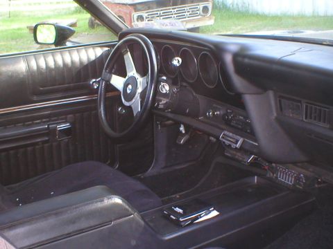 1973 Ford Ranchero - The interior of a 1972 Ford Ranchero is captured, with a glimpse of another vehicle outside.