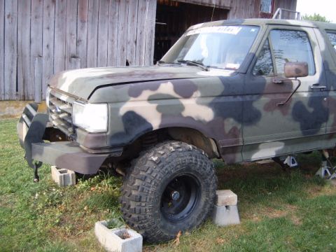 1988 Ford Bronco - This camouflaged Ford Bronco appears to be from the late 1980s, possibly a 1987 model, and is currently lifted on blocks.