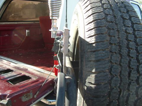 1990 Ford Bronco - Spare tire and CB antenna mounted on the rear of a 1990 Ford Bronco.