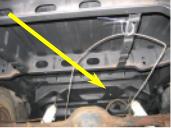 1971 Ford Ranchero - A yellow arrow highlights a part on the underside of a vehicle's rear end.