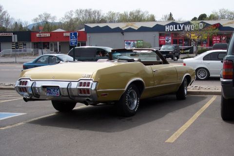 1972 Ford Ranchero - This gold convertible, likely a 1972 Oldsmobile Cutlass Supreme, features distinctive 442 badging and a Colorado license plate.