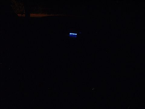 1994 Ford Thunderbird - The illuminated text 'REDTHUNDER' is visible in the darkness, suggesting a sign or display.