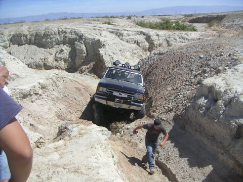 1988 Ford Bronco - 1988 Ford Bronco tackling rough terrain off-road.