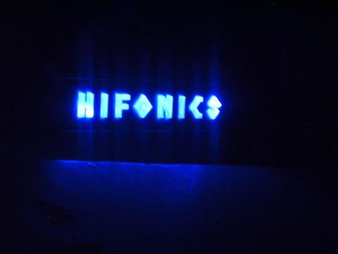 1994 Ford Thunderbird - The HIFONICS logo is lit up in bright blue, standing out against the darkness.
