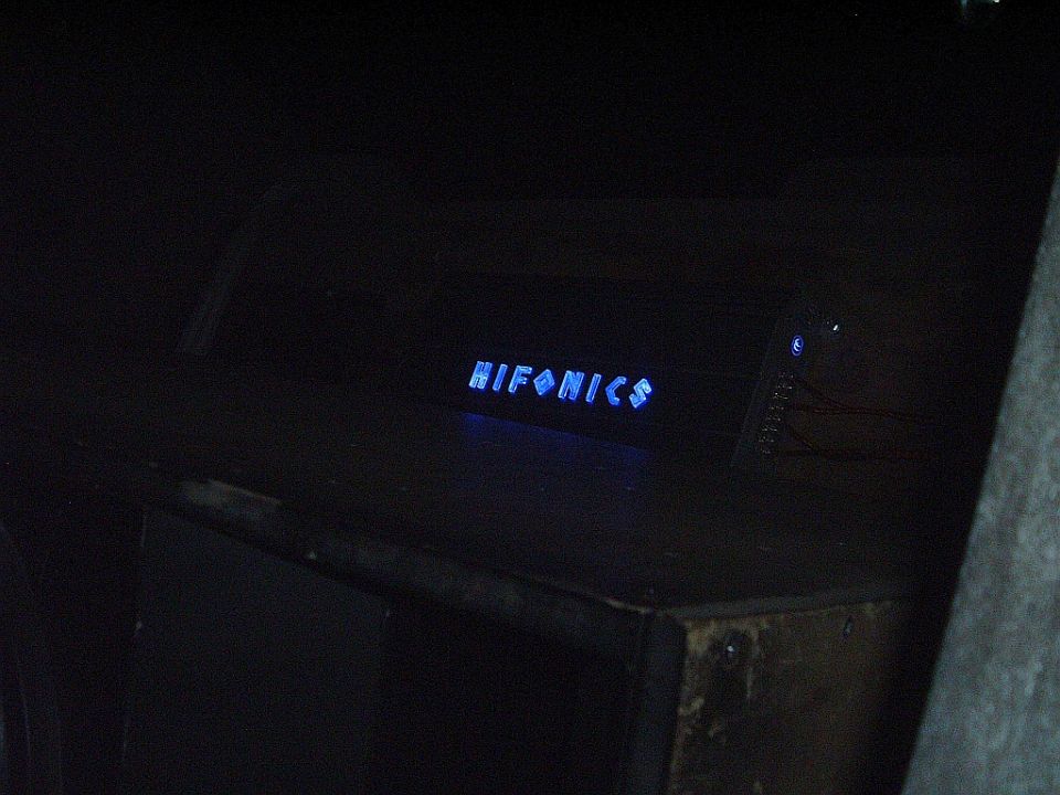 HIFONICS logo illuminated in blue on a dark surface